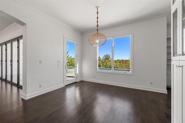 unfurnished dining area with dark wood-type flooring, crown molding, and baseboards