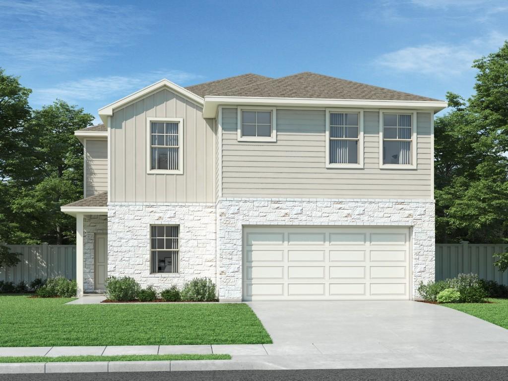 traditional home featuring an attached garage, board and batten siding, fence, driveway, and a front lawn