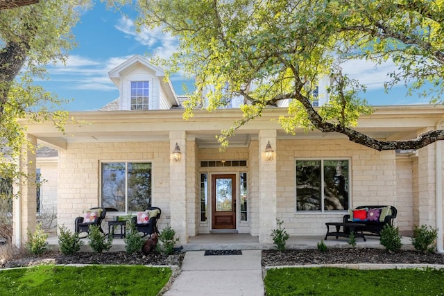 doorway to property with a porch