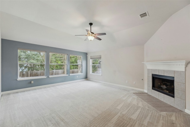 unfurnished living room featuring carpet floors, baseboards, a fireplace, and visible vents