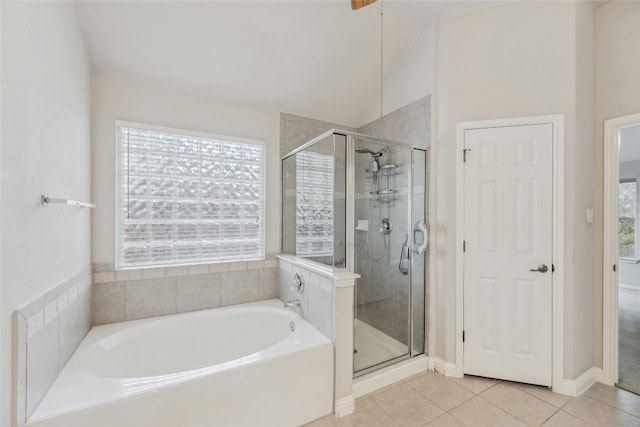 full bath featuring a stall shower, plenty of natural light, and tile patterned flooring