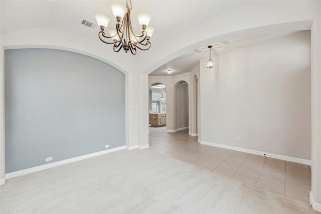 carpeted spare room with baseboards, visible vents, lofted ceiling, tile patterned floors, and a notable chandelier