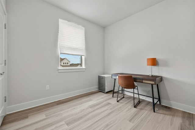 office featuring light wood-type flooring and baseboards