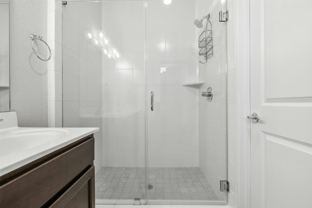 full bath featuring a shower stall and vanity