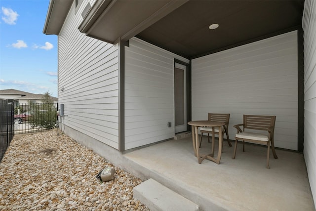 view of patio / terrace featuring fence