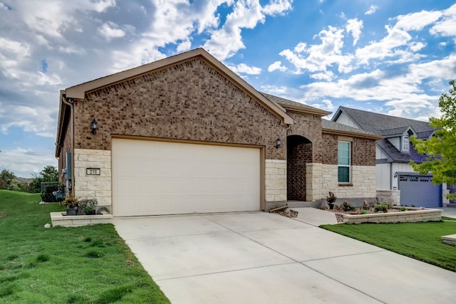 view of front facade featuring brick siding, concrete driveway, an attached garage, a front yard, and stone siding