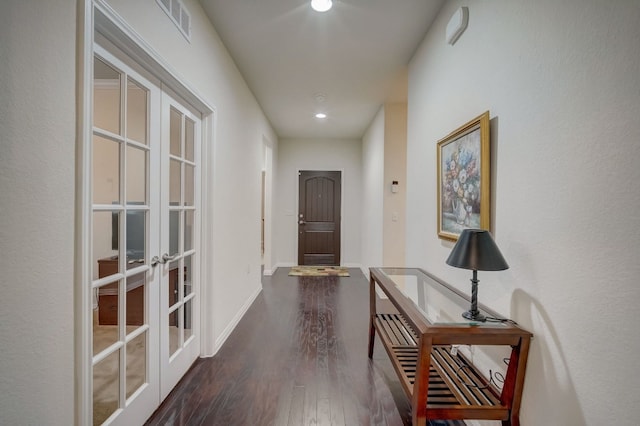 doorway to outside with dark wood-type flooring, french doors, visible vents, and baseboards