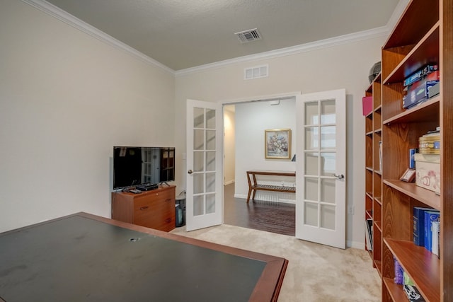 interior space featuring french doors, visible vents, and crown molding