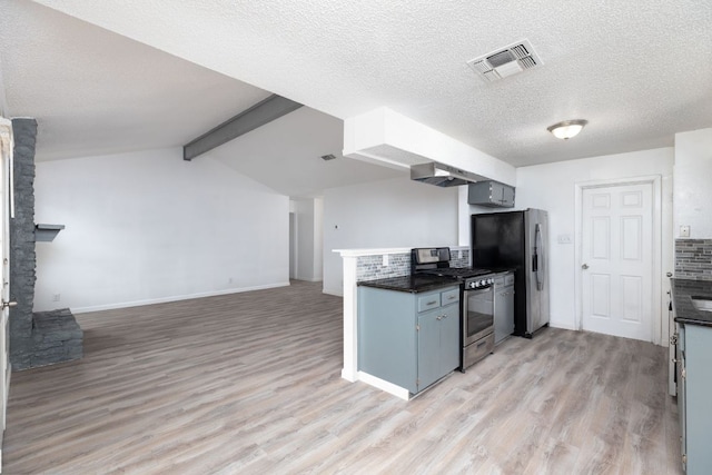 kitchen with open floor plan, appliances with stainless steel finishes, visible vents, and light wood-style floors