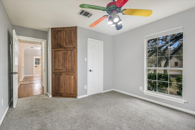 503 Riverview Dr, Georgetown, TX 78628 - unfurnished bedroom featuring light colored carpet and ceiling fan
