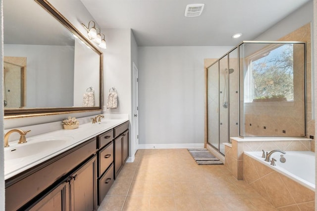 bathroom with a bath, a shower stall, visible vents, and a sink