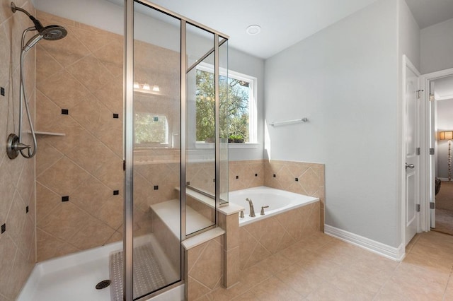 full bathroom featuring a shower stall and a bath