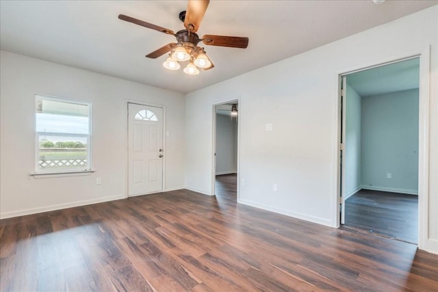 foyer with ceiling fan, wood finished floors, and baseboards
