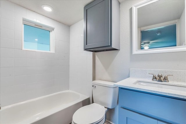bathroom featuring shower / bathtub combination, vanity, and toilet