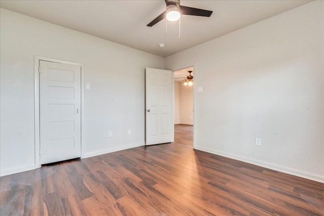 unfurnished bedroom featuring a ceiling fan, baseboards, and wood finished floors