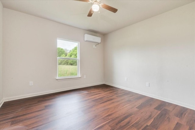 unfurnished room featuring dark wood-style flooring, a wall unit AC, a ceiling fan, and baseboards