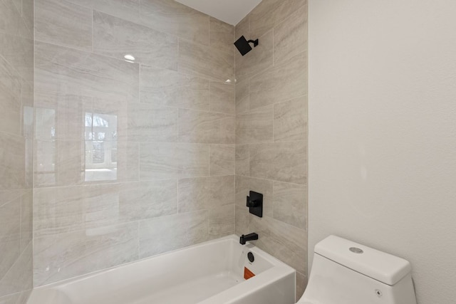 bathroom with shower / washtub combination and toilet