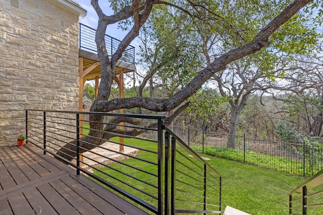 wooden terrace with fence and a yard