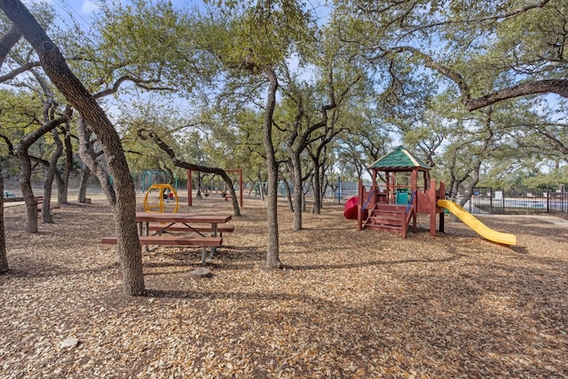 community jungle gym with fence