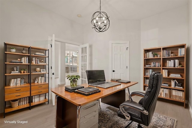 office featuring a chandelier and light wood finished floors