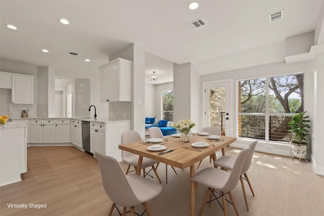 dining room featuring light wood-style floors, visible vents, and recessed lighting