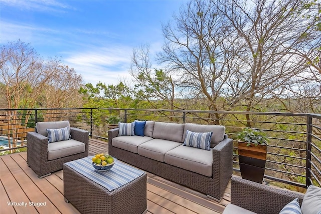 wooden terrace with an outdoor hangout area