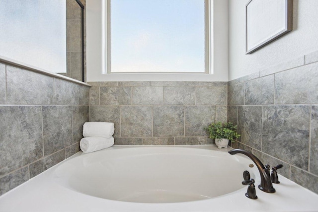 bathroom with a garden tub