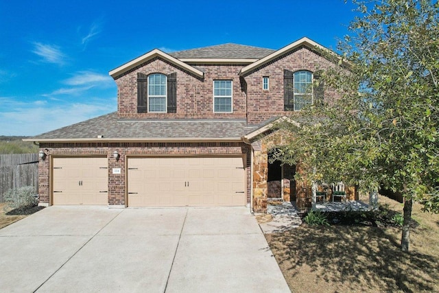 view of front of property featuring driveway, a shingled roof, a garage, and brick siding