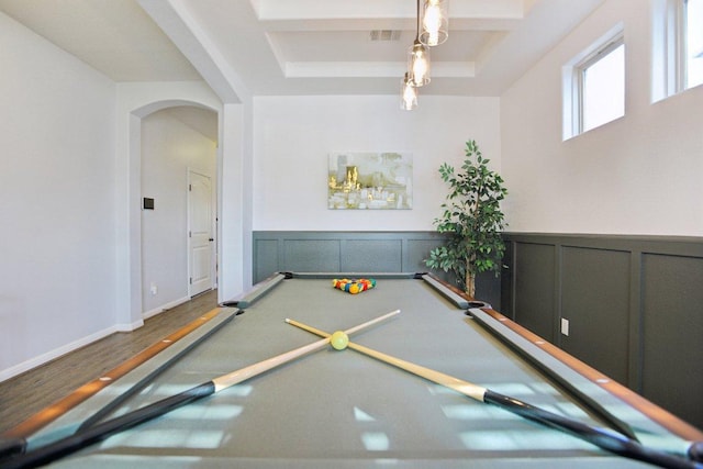 playroom with visible vents, arched walkways, a wainscoted wall, wood finished floors, and a decorative wall