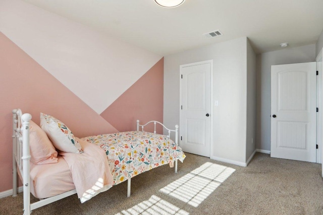 bedroom featuring carpet and baseboards