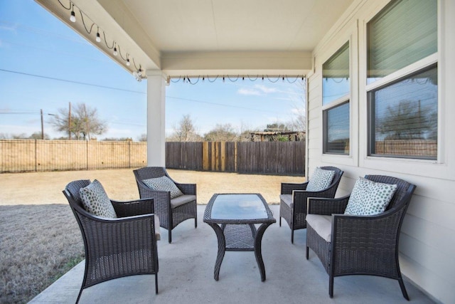 view of patio featuring fence