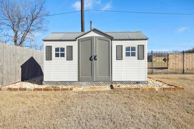 view of shed featuring a fenced backyard