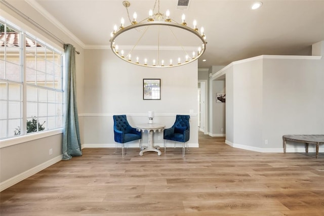 sitting room with ornamental molding, wood finished floors, visible vents, and baseboards