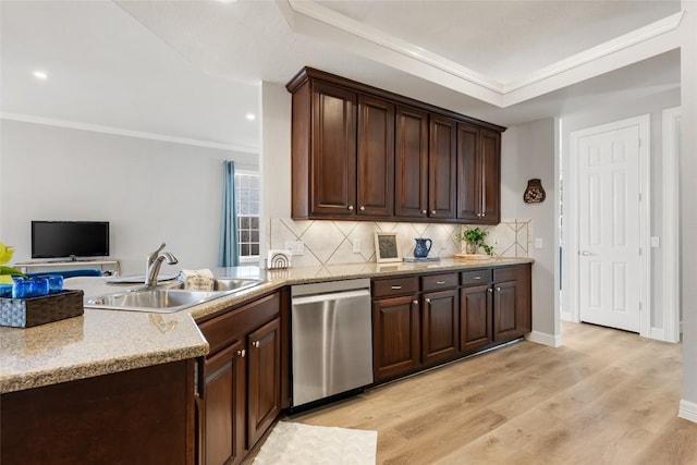 kitchen featuring a sink, light wood-style floors, ornamental molding, dishwasher, and tasteful backsplash