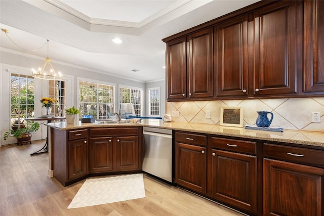 kitchen featuring crown molding, tasteful backsplash, a sink, light wood-type flooring, and dishwasher