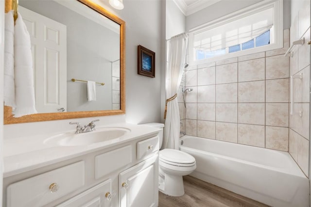 bathroom with crown molding, toilet, shower / tub combo, vanity, and wood finished floors