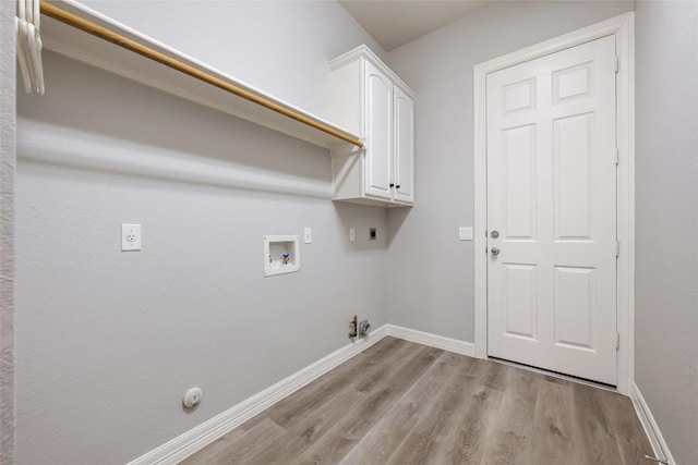 washroom featuring light wood finished floors, gas dryer hookup, hookup for an electric dryer, and washer hookup