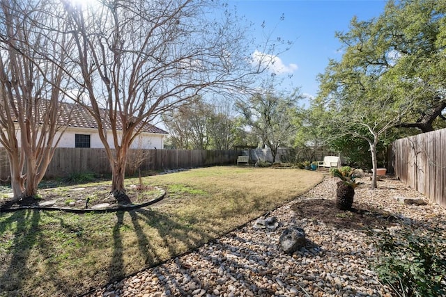 view of yard with a fenced backyard