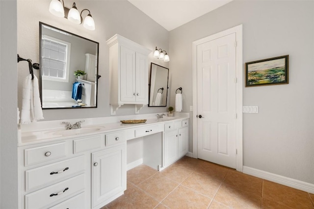 full bath with tile patterned floors, a sink, baseboards, and double vanity