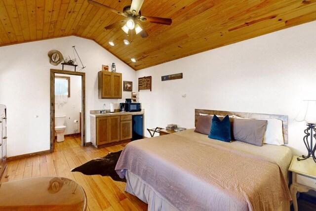 961 Buttercup Ln, Wimberley, TX 78676 - bedroom featuring wooden ceiling, lofted ceiling, light wood-style flooring, baseboards, and ensuite bath