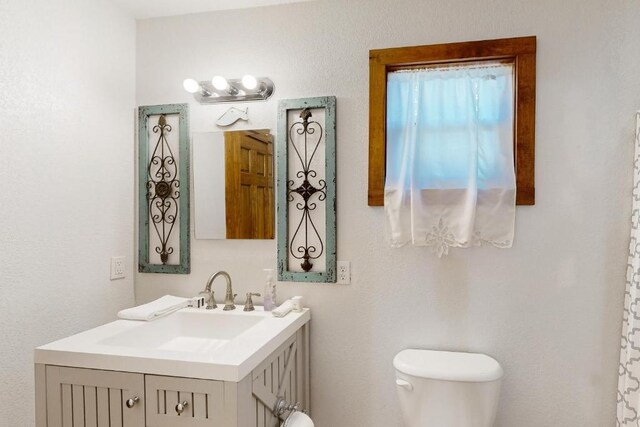 961 Buttercup Ln, Wimberley, TX 78676 - bathroom with toilet and vanity
