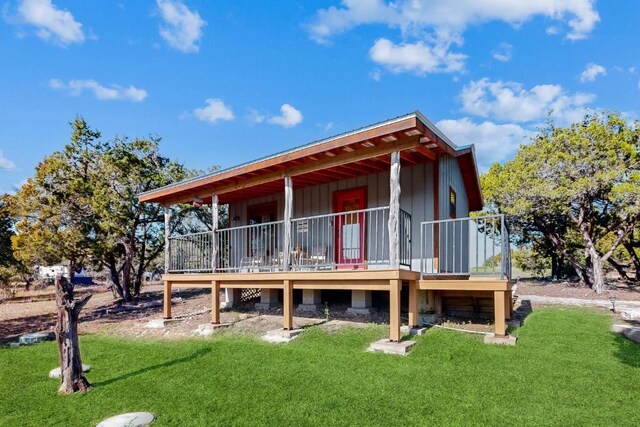 961 Buttercup Ln, Wimberley, TX 78676 - rear view of property with a yard and a wooden deck