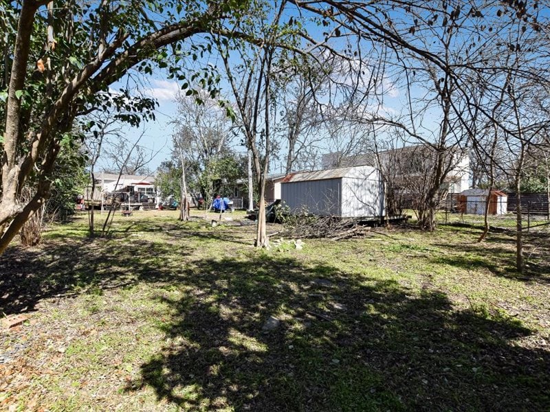 1111 Taulbee Ln, Austin, TX 78757 - view of yard with a storage unit