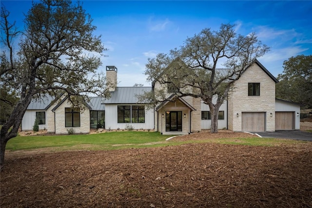 12120 Fitzhugh Pl, Dripping Springs, TX 78620 - modern farmhouse style home with a standing seam roof, a chimney, board and batten siding, driveway, and metal roof