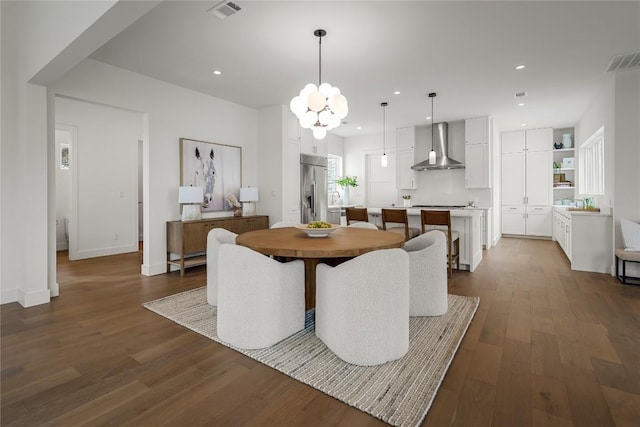 12120 Fitzhugh Pl, Dripping Springs, TX 78620 - dining space with dark wood finished floors, a chandelier, recessed lighting, and baseboards