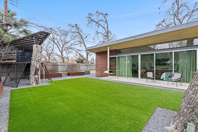 view of yard with a patio area and fence