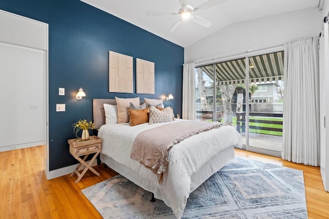 bedroom with lofted ceiling, access to outside, baseboards, and light wood-style floors