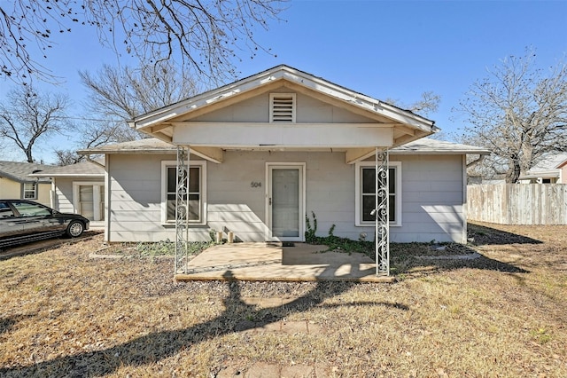 view of front of house featuring fence