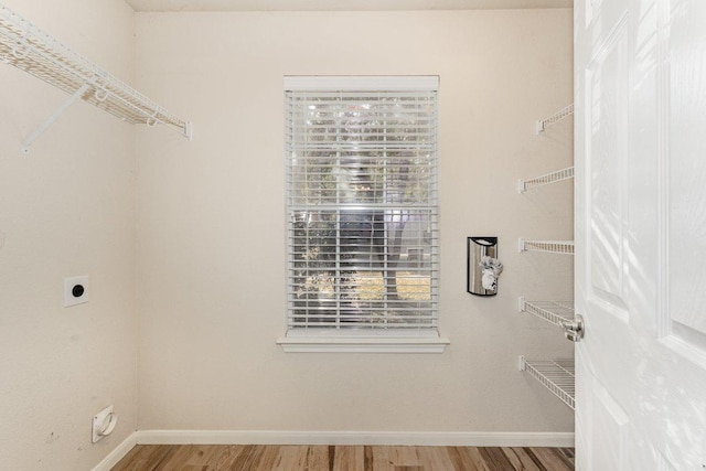 spacious closet with wood finished floors