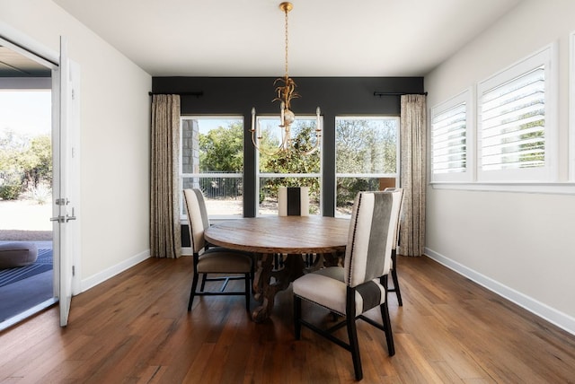 dining room with a wealth of natural light and wood finished floors